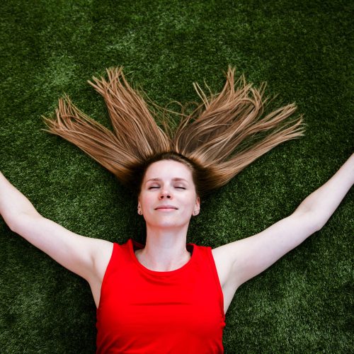 Woman relaxing on the artificial grass